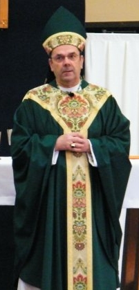 Most Rev. Robert J. Cunningham celebrating mass at the Alibrandi Catholic Center, Newman center for Syracuse University.